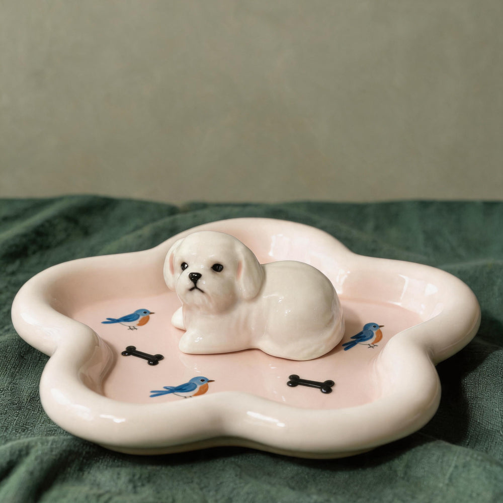 Pink dog on a star-shaped pet ring dish
