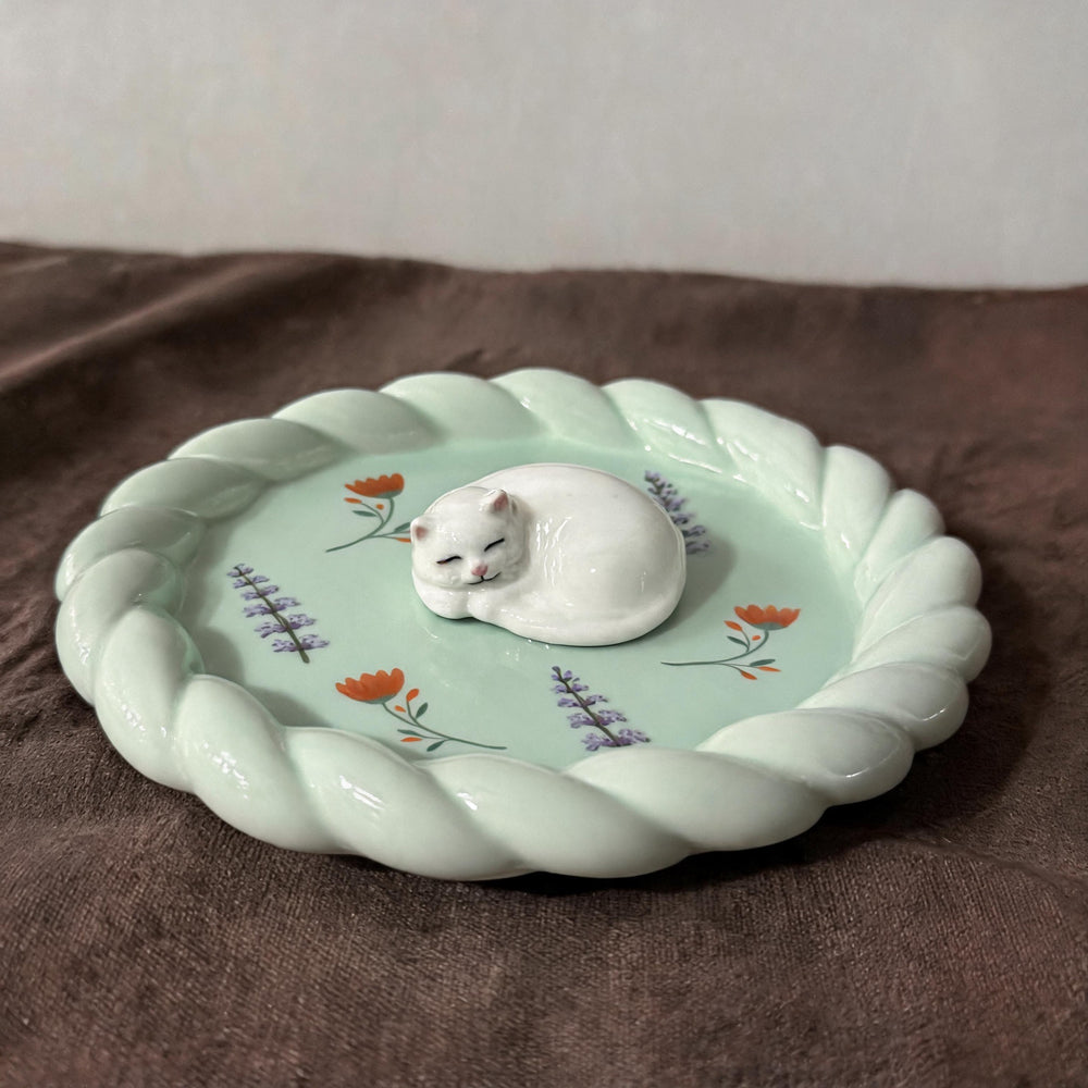 Teal cat on a custom stuffed-crust pet trinket dish