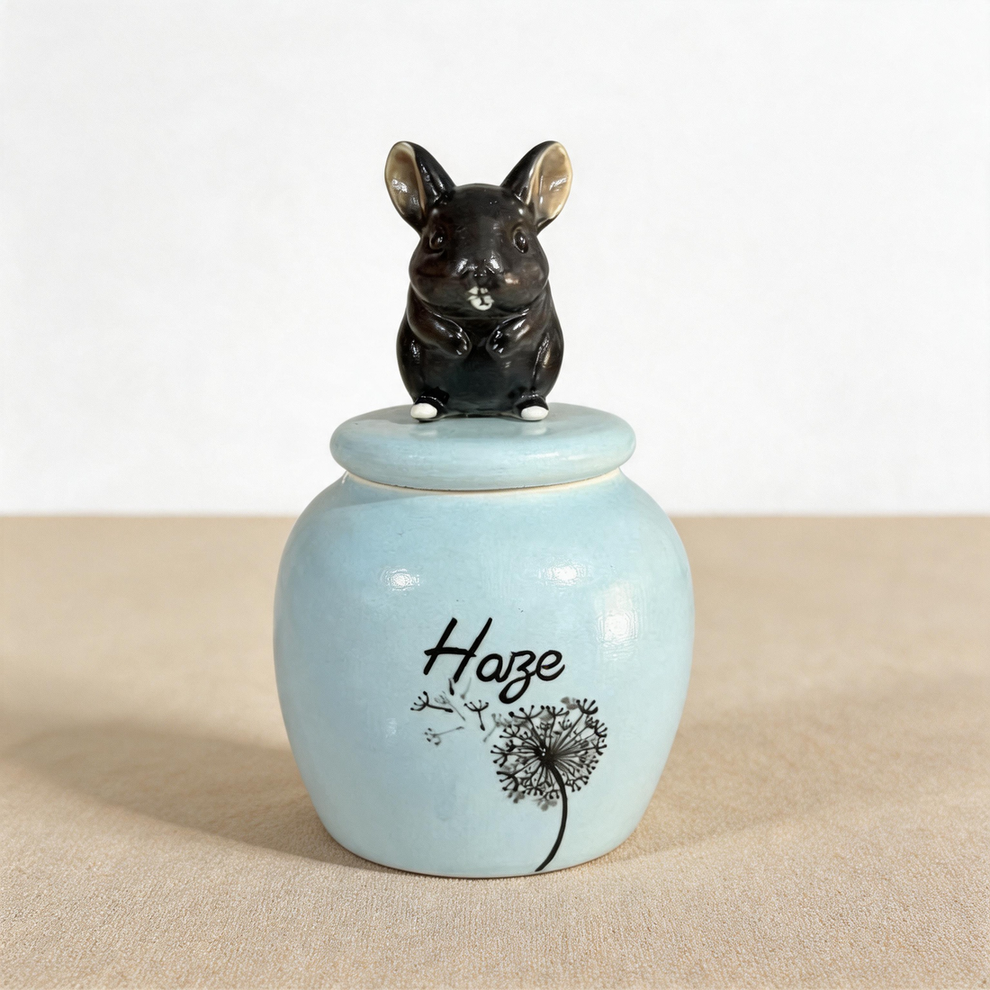 Hand-painted ceramic small pet figurine urn in blue by Farbe Ceramics, a keepsake honouring guinea pigs, chinchillas, and other chatty small companions