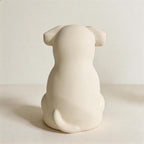 Styled on a shelf of a personalized custom pet sculpture urn for ashes — a handmade ceramic pet memorial urn, hand-painted from your photos to match your pet and made to order. Custom pet memorial by Farbe Ceramics.