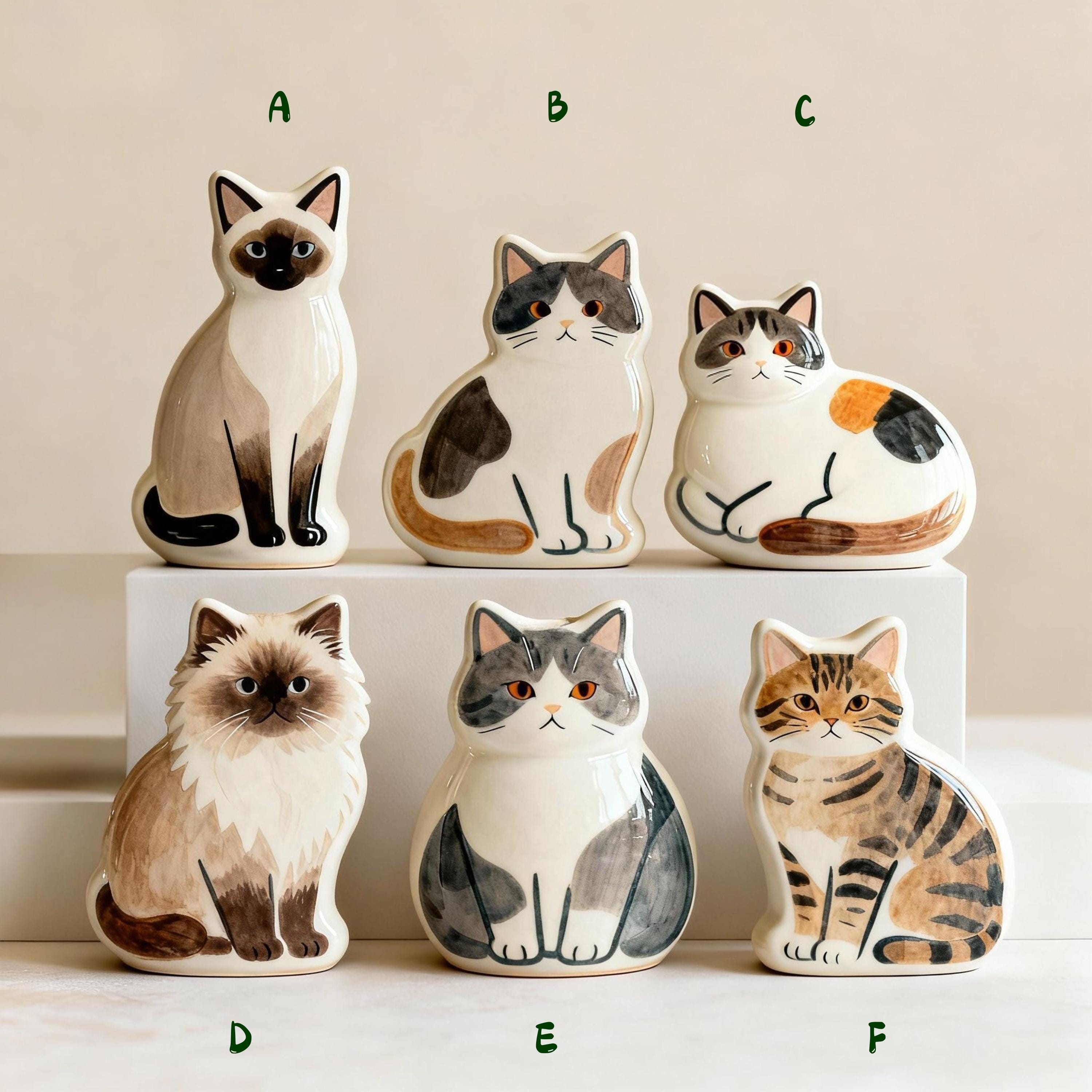 Shown with name and dates of a personalized flat pet urn for ashes — a handmade ceramic pet memorial urn, hand-painted from your photos to match your pet and made to order. Custom pet memorial by Farbe Ceramics.