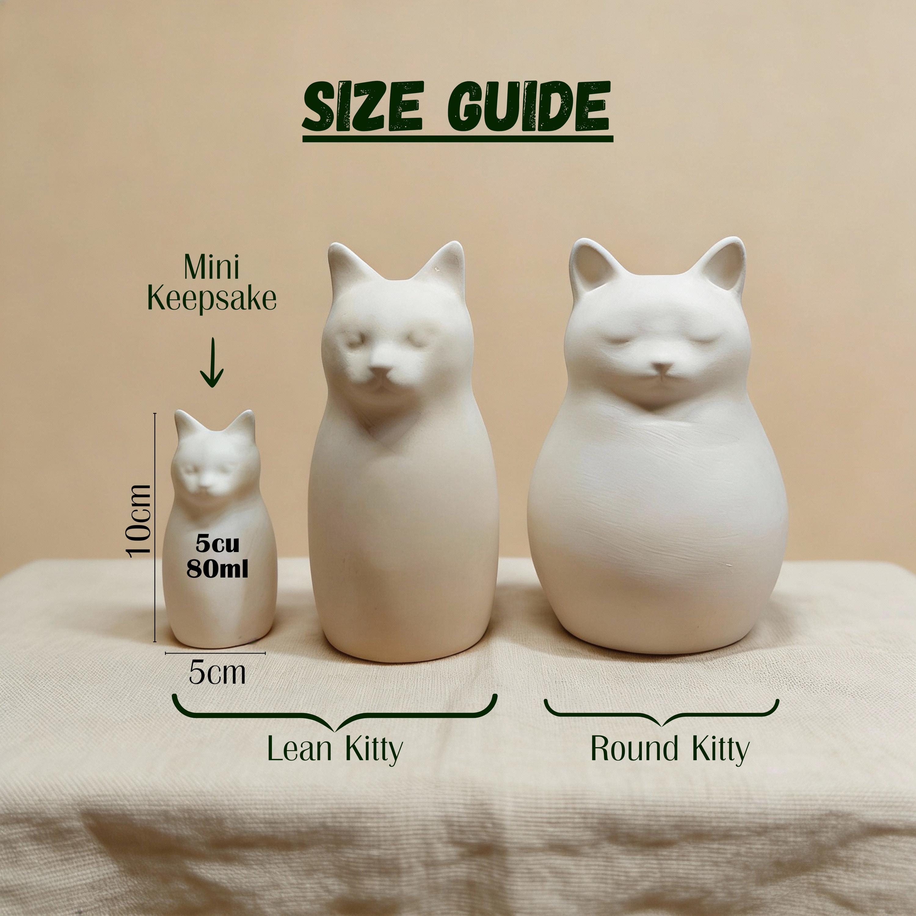 Shown with name and dates of a cat-shaped urn for human ashes — a handmade ceramic cat lover cremation urn, hand-painted and personalized, made to order from keepsake to full sizes by Farbe Ceramics.