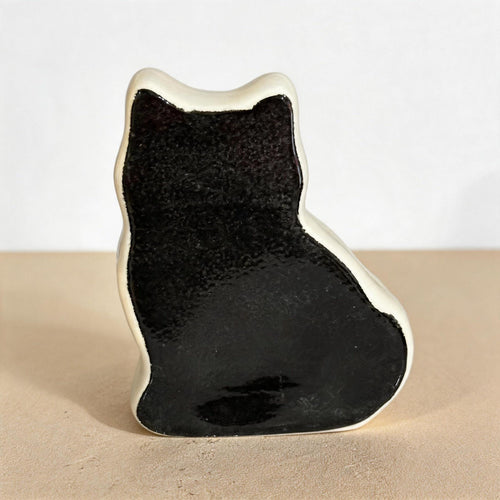 Side profile of a personalized flat pet urn for ashes — a handmade ceramic pet memorial urn, hand-painted from your photos to match your pet and made to order. Custom pet memorial by Farbe Ceramics.