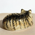 Tabby sleeping cat urn for ashes — a handmade, hand-painted ceramic cat cremation urn, custom made to order from your photos and personalized with name and dates. Pet memorial keepsake by Farbe Ceramics.