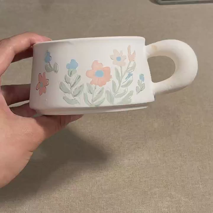 Hand painting a wildflower mug — Farbe Ceramics studio process