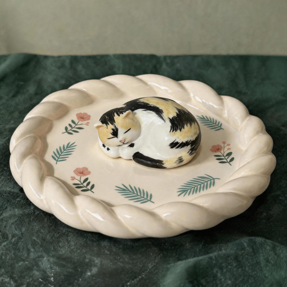 White cat on a custom stuffed-crust pet trinket dish